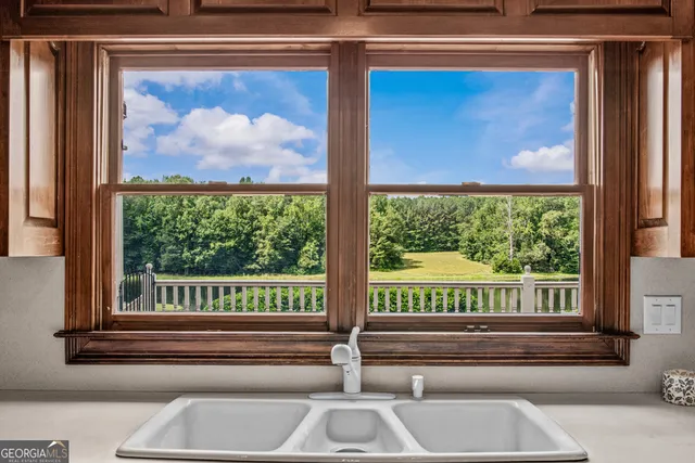 a balcony view with a lake view and a outdoor view