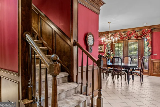 a kitchen with stainless steel appliances granite countertop a refrigerator a stove and a sink with granite countertops