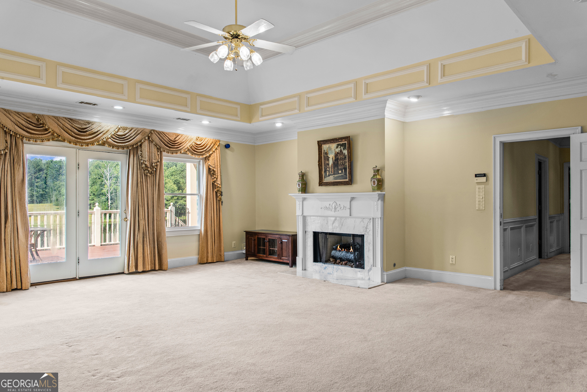 2720 Doster Road Madison, GA 30650 - Photo 30 of 60 a view of an empty room with a fireplace and a window