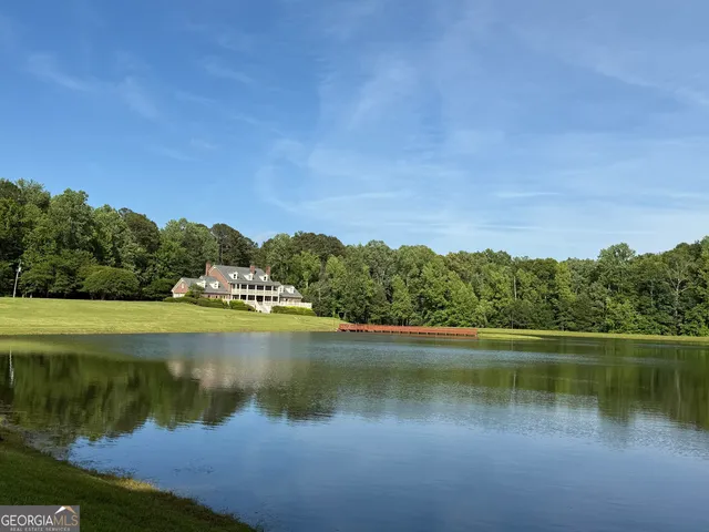 a view of lake with green space