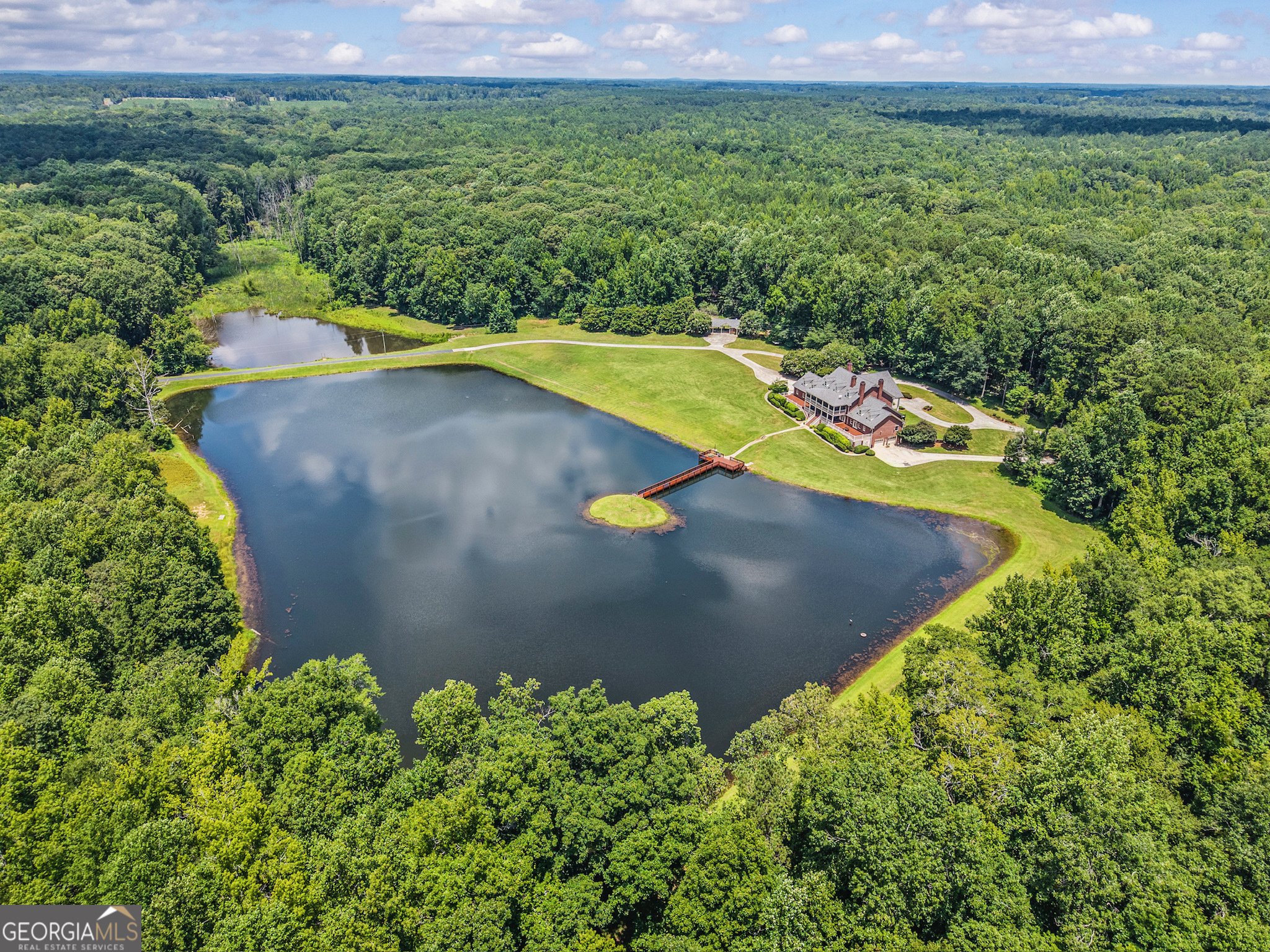 2720 Doster Road Madison, GA 30650 - Photo 5 of 60 a view of a back yard of a house