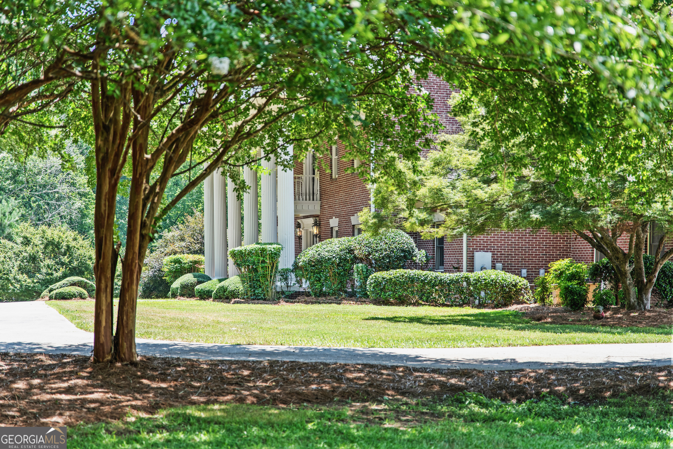 2720 Doster Road Madison, GA 30650 - Photo 8 of 60 a view of a house with a yard and large trees