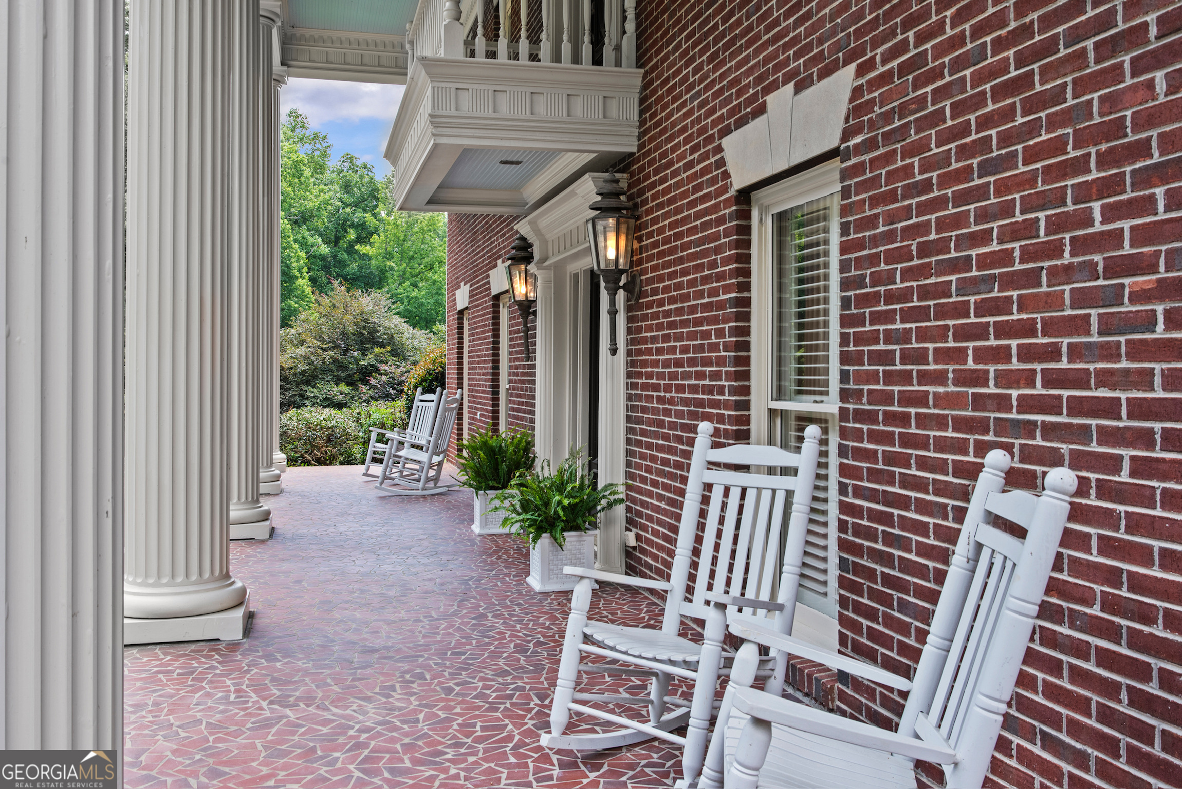 2720 Doster Road Madison, GA 30650 - Photo 9 of 60 a view of a patio with a table and chairs and potted plants