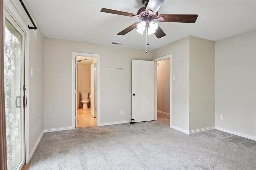 305 South Cockrell Hill Road Ovilla, TX 75154 - Photo 25 of 40 an empty room with a ceiling fan and a window