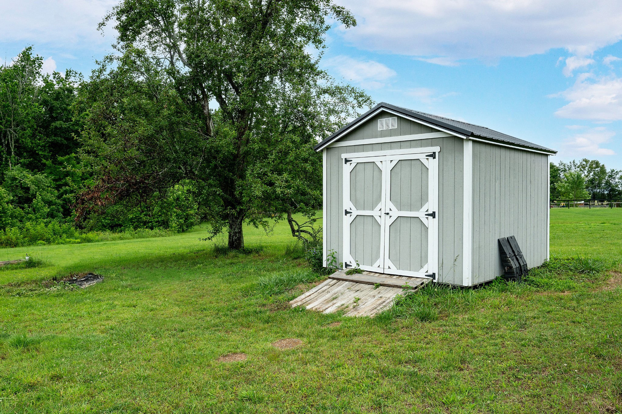 2995 Oak Grove Church Road Bethpage, TN 37022 - Photo 26 of 28 a view of backyard with a garden and plants