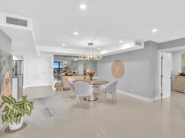a view of a chairs and table in patio