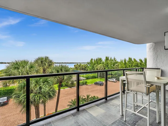 a bathroom with a tub sink double vanity granite tub and shower