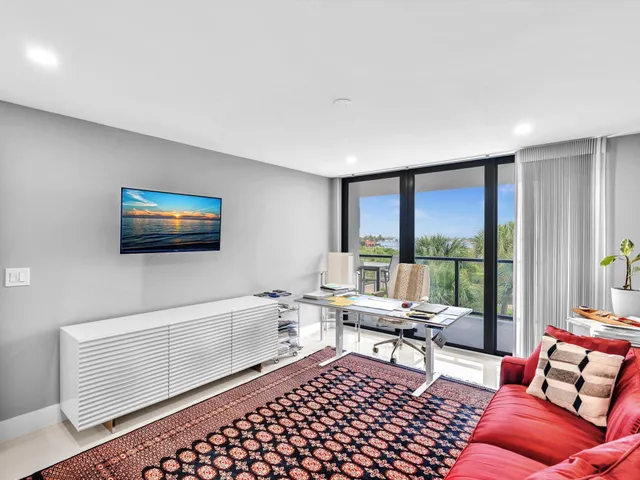 a living room with furniture and a table