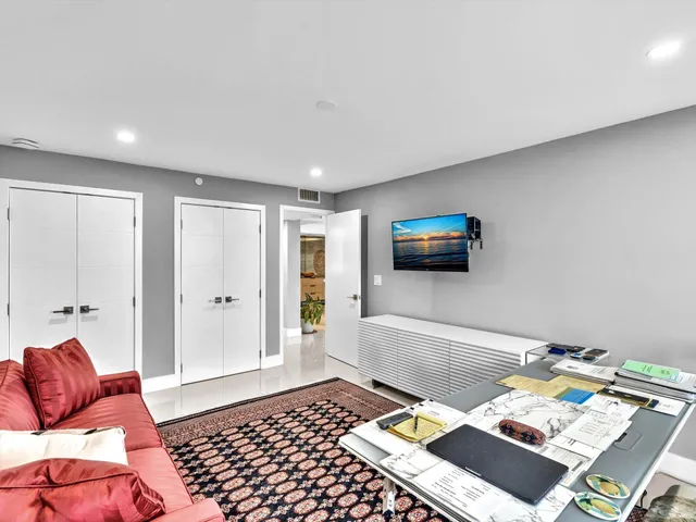 a dining room with furniture water view and a window