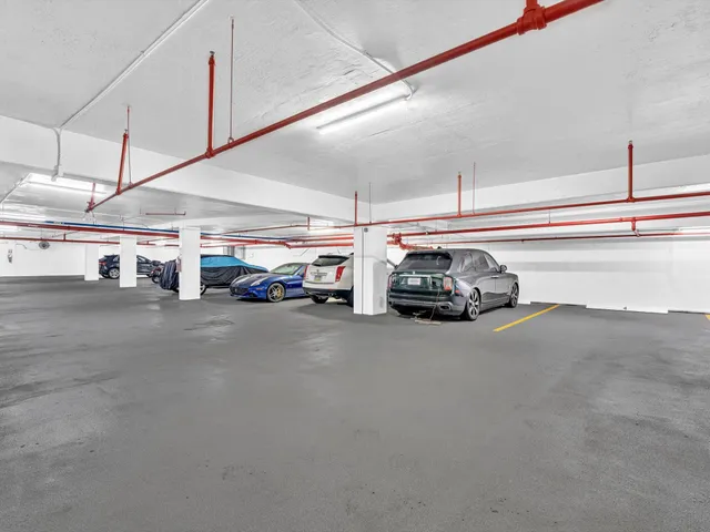 a view of a garden with a building in the background