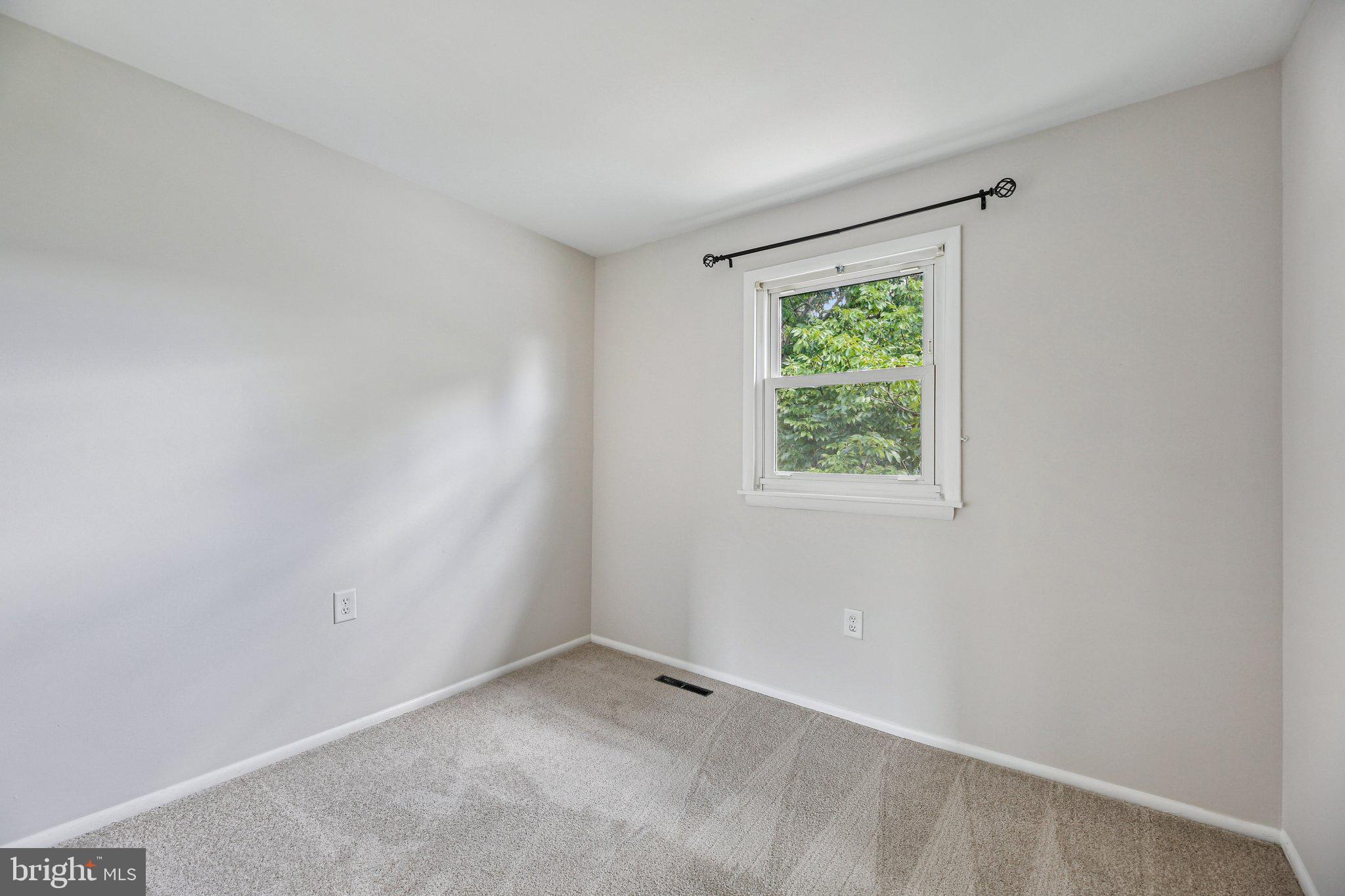5603 Selford Road Baltimore, MD 21227 - Photo 12 of 31 an empty room with a window
