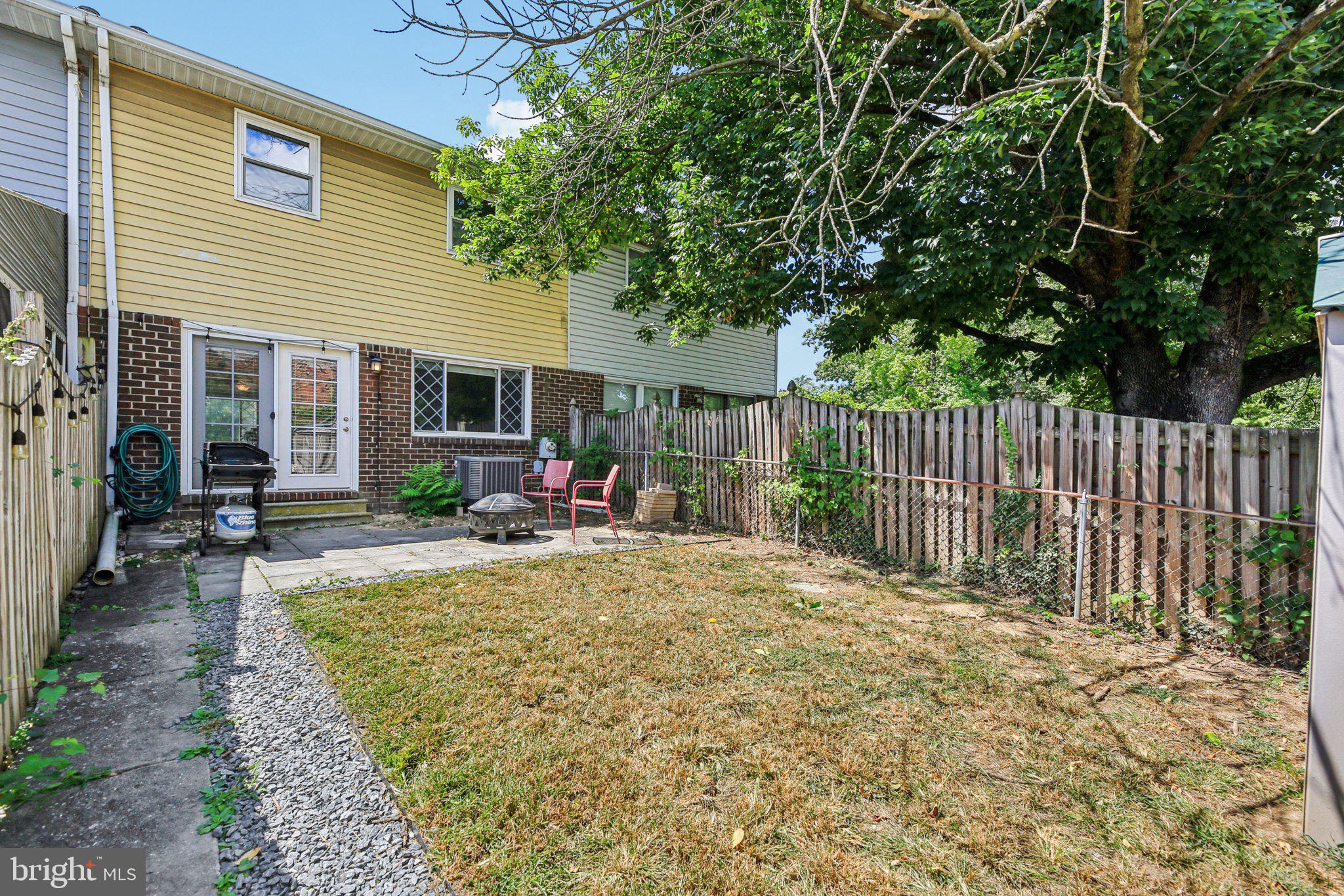 5603 Selford Road Baltimore, MD 21227 - Photo 20 of 31 a view of a house with backyard and sitting area