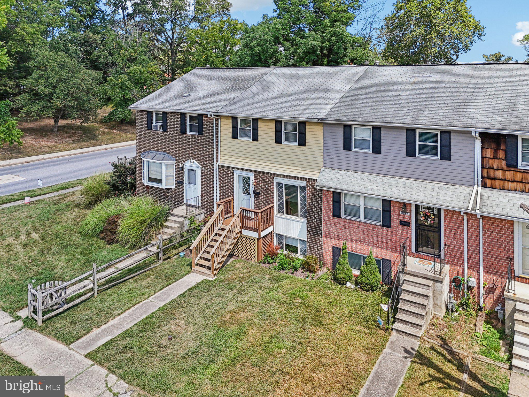 5603 Selford Road Baltimore, MD 21227 - Photo 23 of 31 an aerial view of a house with a yard table and chairs