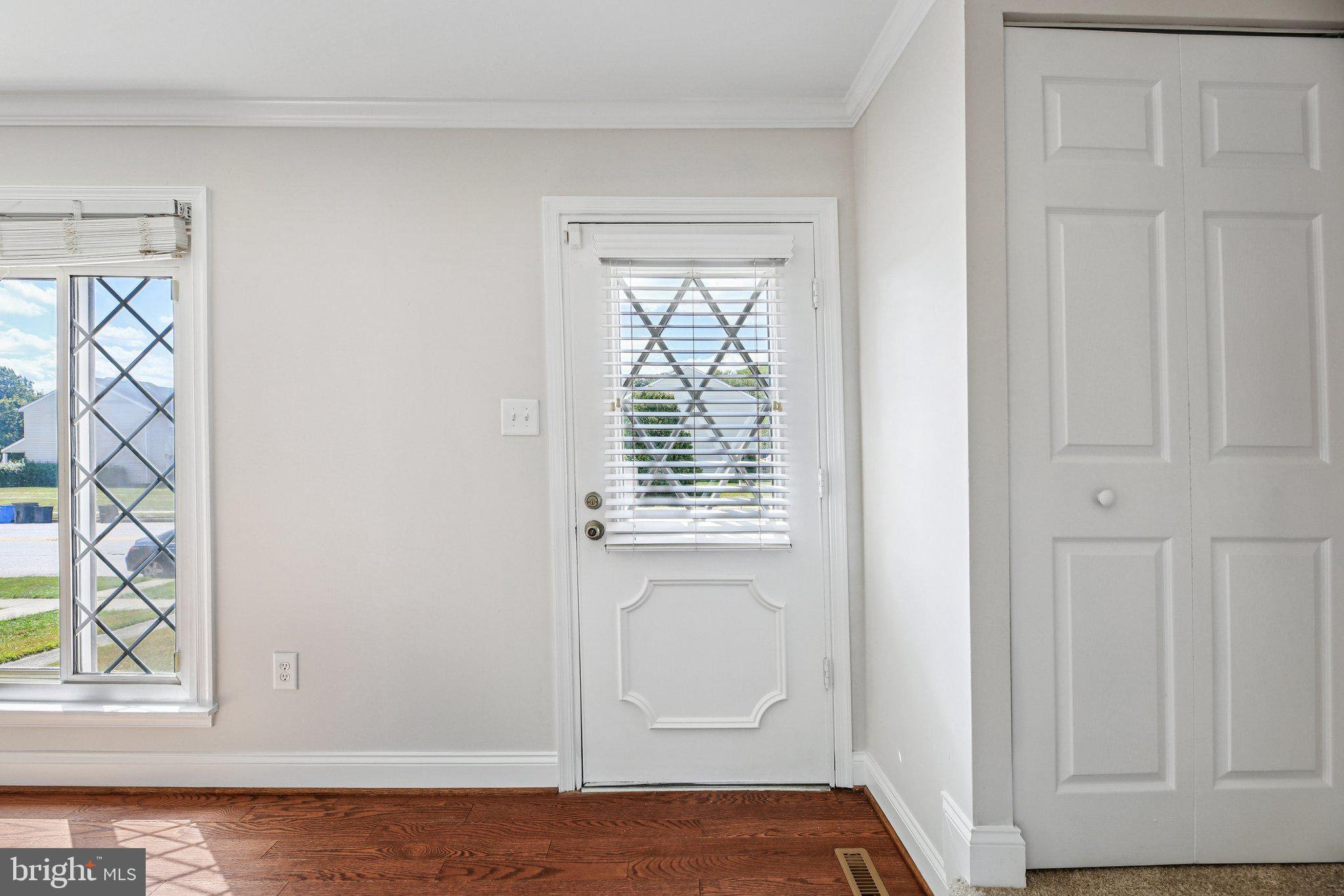 5603 Selford Road Baltimore, MD 21227 - Photo 3 of 31 a view of front door with wooden floor