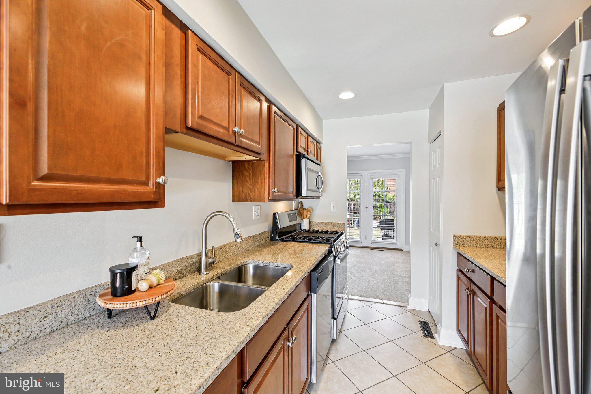 5603 Selford Road Baltimore, MD 21227 - Photo 8 of 31 a kitchen that has a sink and a refrigerator