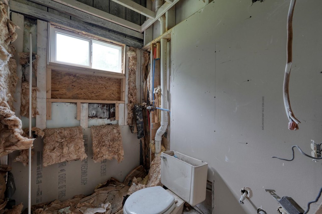 580 Emmaus Road Epworth, GA 30541 - Photo 16 of 33 a bathroom with a toilet and a shower