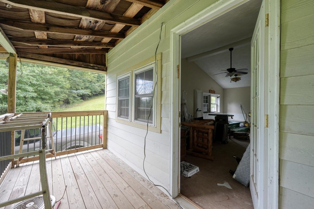 580 Emmaus Road Epworth, GA 30541 - Photo 19 of 33 a view of a porch with wooden floor and furniture