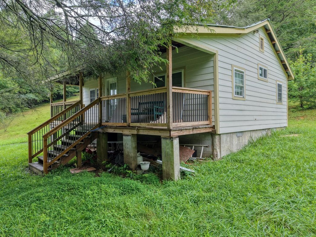 580 Emmaus Road Epworth, GA 30541 - Photo 3 of 33 a view of a house with a yard and sitting area