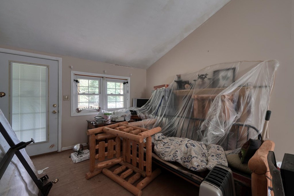 580 Emmaus Road Epworth, GA 30541 - Photo 6 of 33 a bedroom with furniture and a window