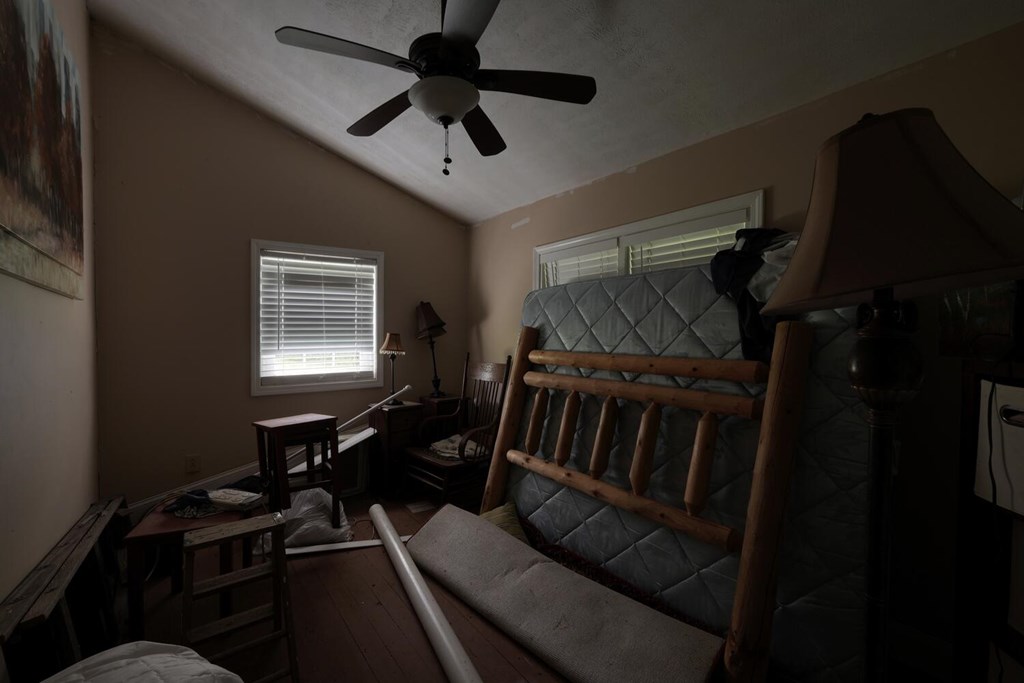 580 Emmaus Road Epworth, GA 30541 - Photo 10 of 33 a bedroom with furniture window and a ceiling fan