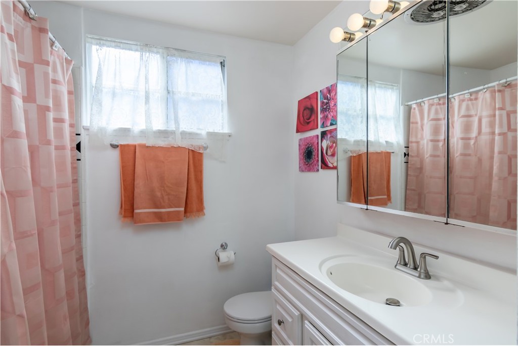 11543 Swinton Avenue Granada Hills, CA 91344 - Photo 16 of 24 a bathroom with a sink and a mirror