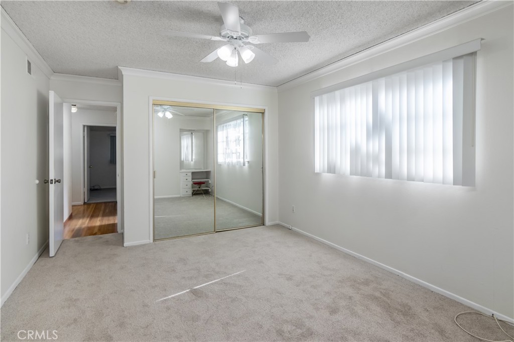 11543 Swinton Avenue Granada Hills, CA 91344 - Photo 18 of 24 an empty room with fan and windows