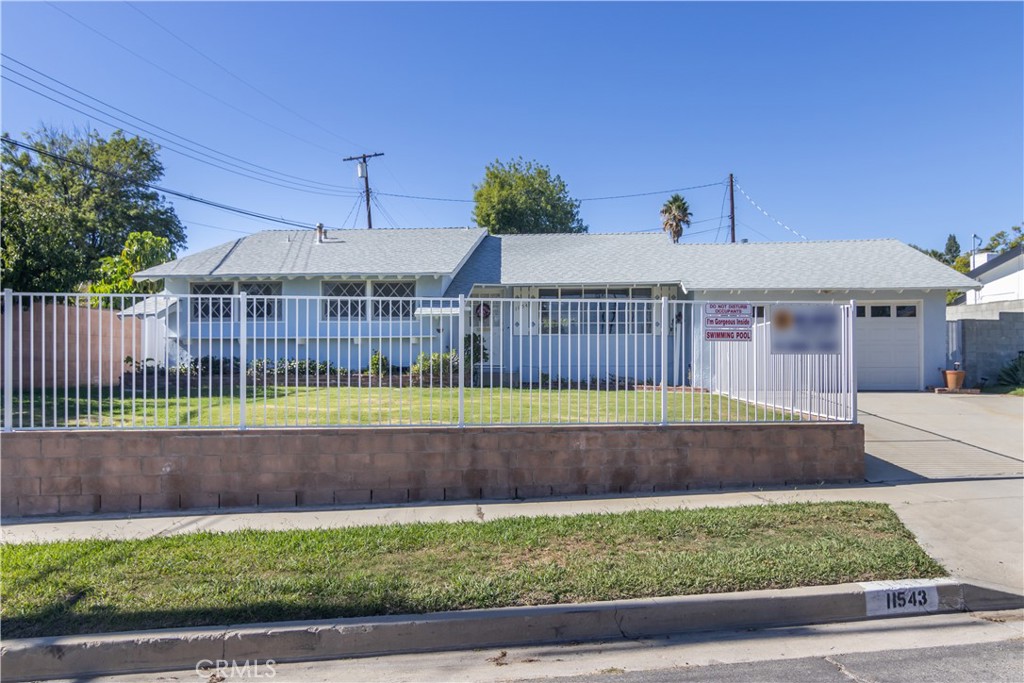 11543 Swinton Avenue Granada Hills, CA 91344 - Photo 2 of 24 a view of front door of a house