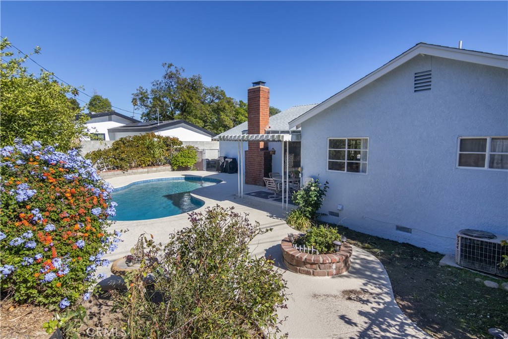 11543 Swinton Avenue Granada Hills, CA 91344 - Photo 23 of 24 a front view of a house with a yard