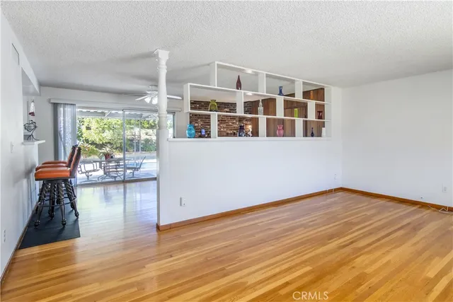 a view of livingroom with furniture wooden floor and windows