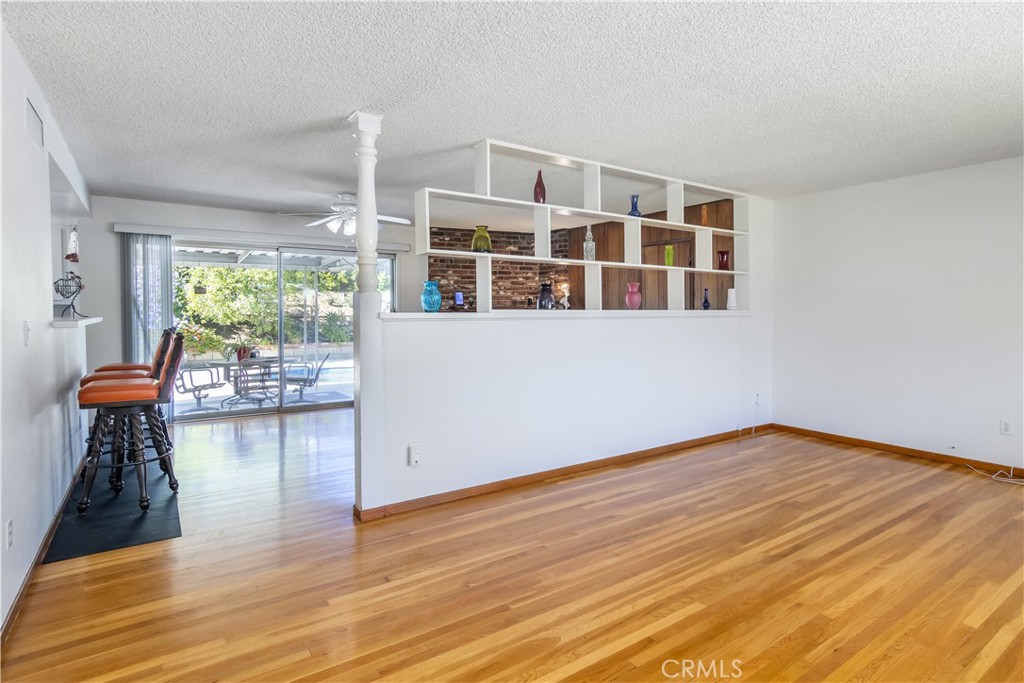 11543 Swinton Avenue Granada Hills, CA 91344 - Photo 4 of 24 a view of livingroom with furniture wooden floor and windows