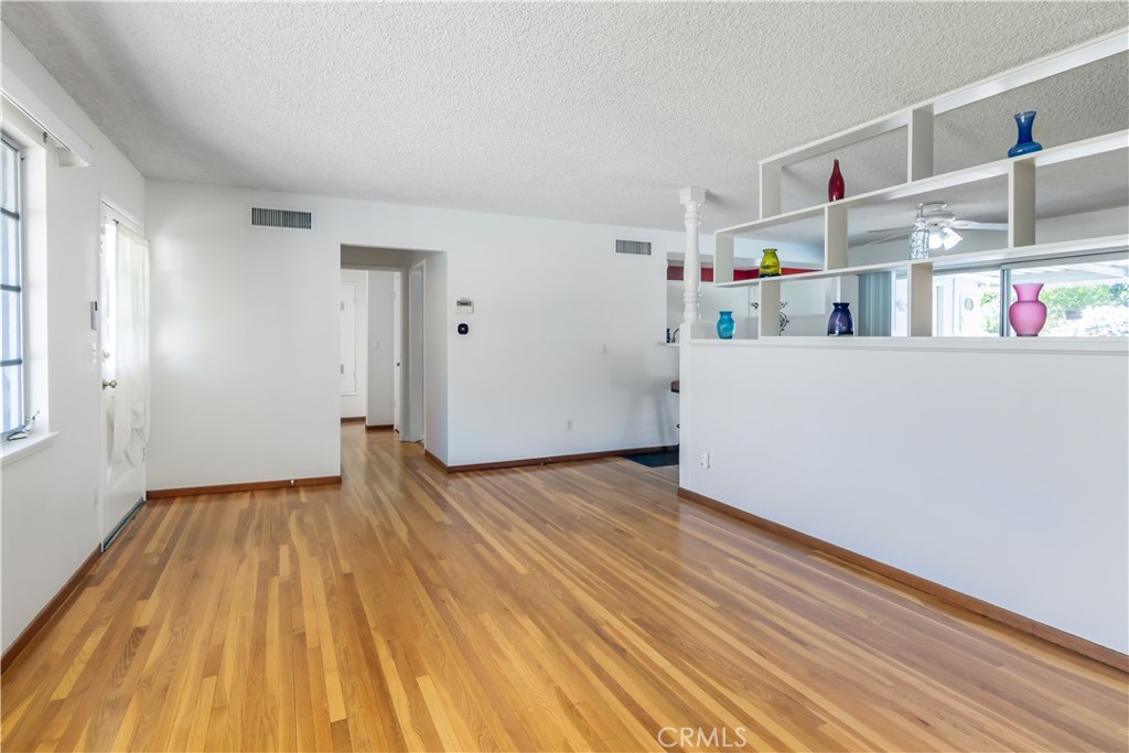 11543 Swinton Avenue Granada Hills, CA 91344 - Photo 5 of 24 a view of empty room with wooden floor
