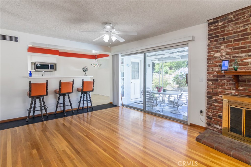11543 Swinton Avenue Granada Hills, CA 91344 - Photo 9 of 24 a living room with furniture and a fireplace