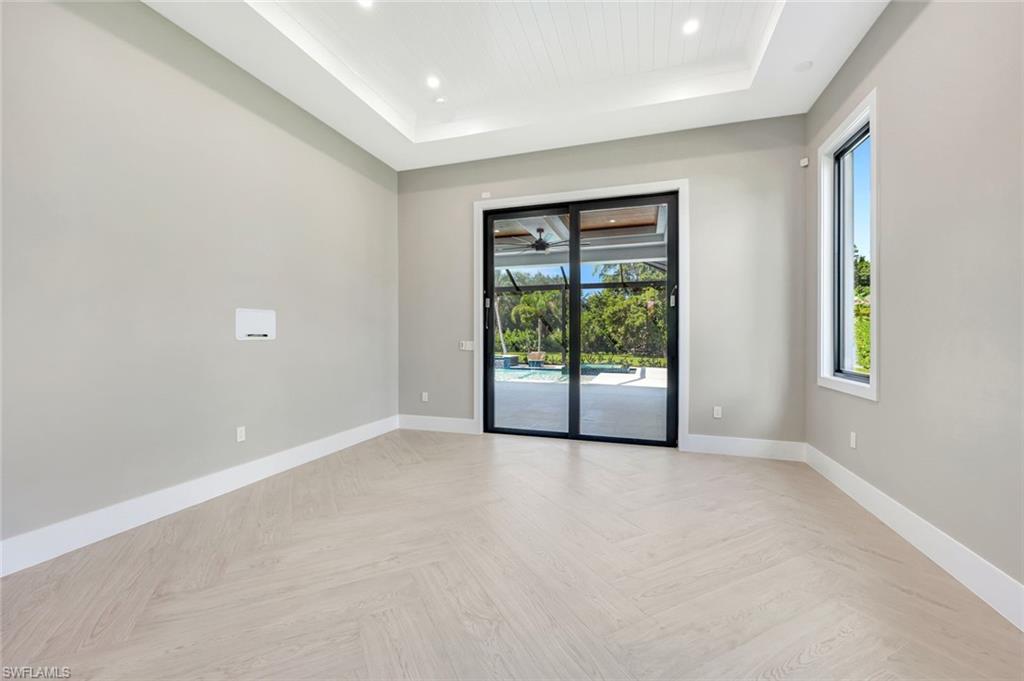 10493 Winterview Drive Naples, FL 34110 - Photo 11 of 40 an empty room with windows