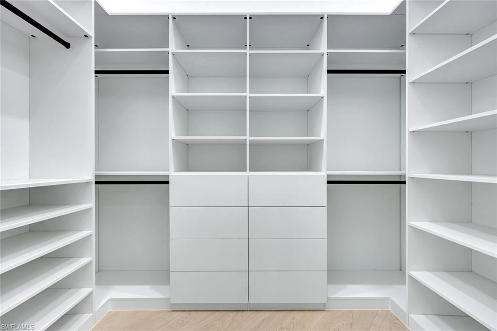 10493 Winterview Drive Naples, FL 34110 - Photo 13 of 40 a view of walk in closet with empty racks