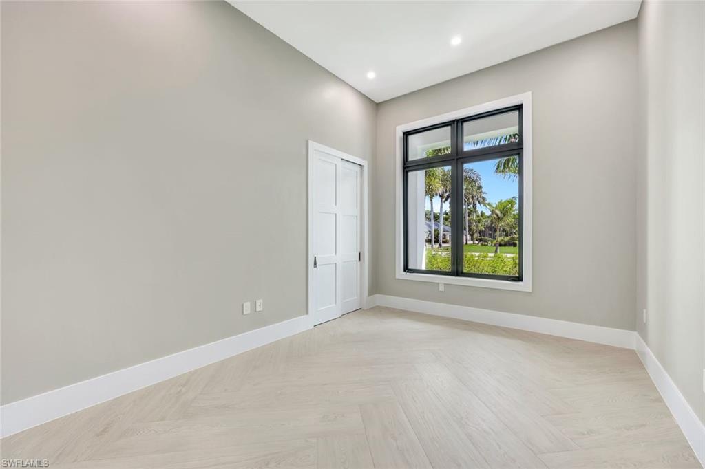 10493 Winterview Drive Naples, FL 34110 - Photo 14 of 40 an empty room with windows and closet