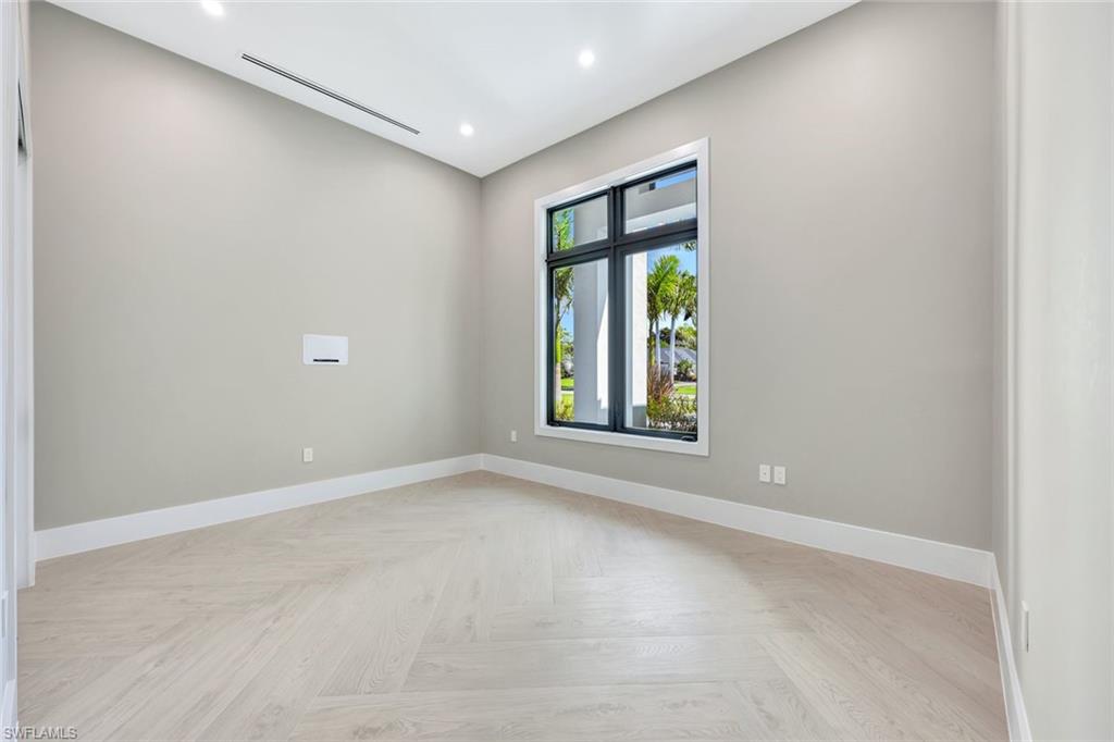 10493 Winterview Drive Naples, FL 34110 - Photo 18 of 40 an empty room with a window