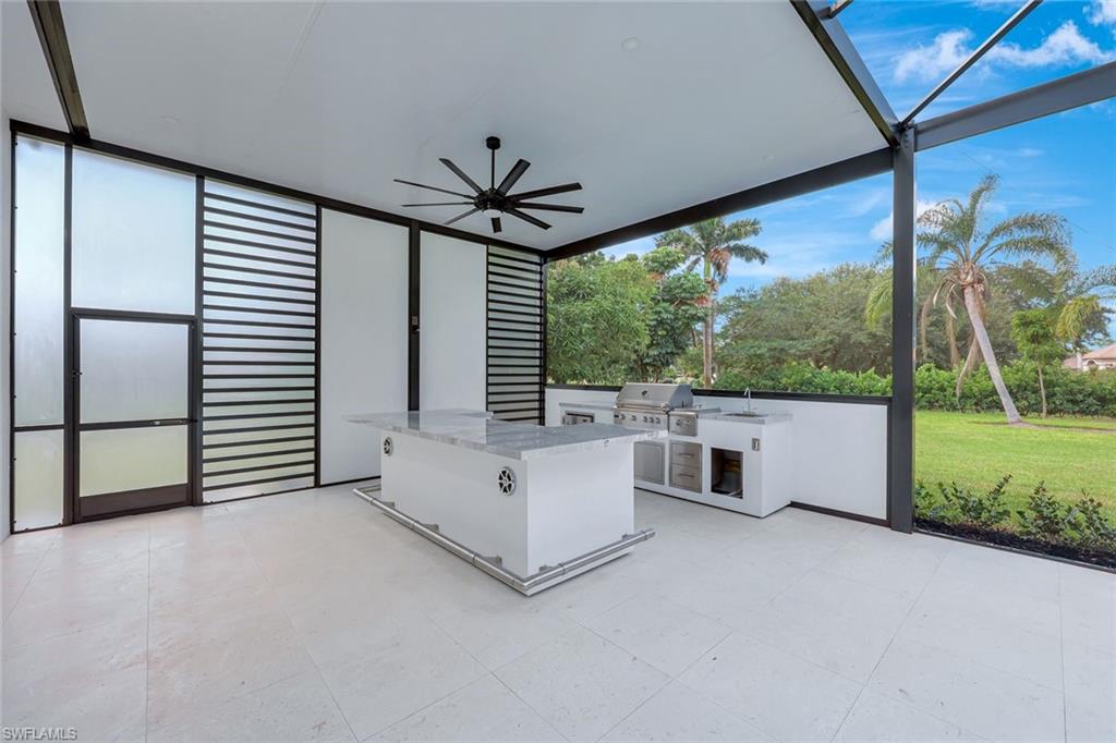 10493 Winterview Drive Naples, FL 34110 - Photo 27 of 40 wooden floor in an empty room with a large window