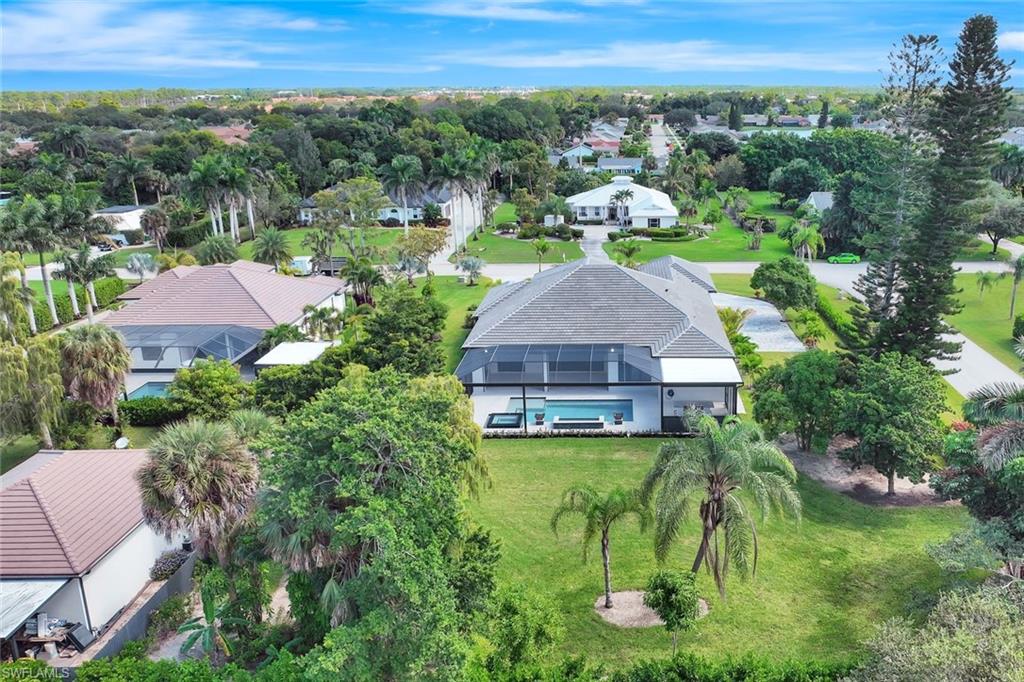 10493 Winterview Drive Naples, FL 34110 - Photo 36 of 40 a aerial view of a house with a yard