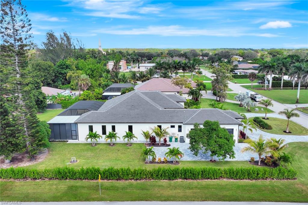 10493 Winterview Drive Naples, FL 34110 - Photo 37 of 40 a aerial view of a house with a big yard