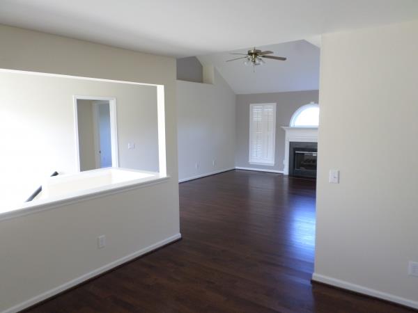 809 Rands Way Columbia, TN 38401 - Photo 3 of 10 a view of an empty room with wooden floor and a window