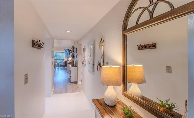 a view of living room with furniture and wooden floor