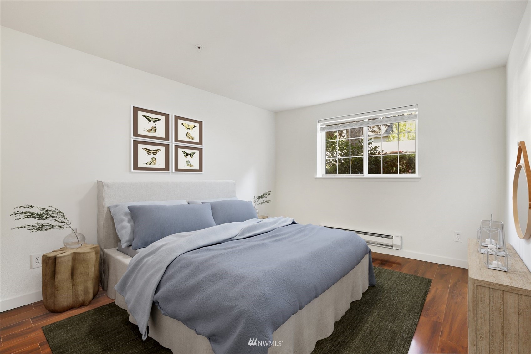 949 Aberdeen Avenue Northeast, Unit B104 Renton, WA 98056 - Photo 12 of 20 a bedroom with a bed and wooden floor