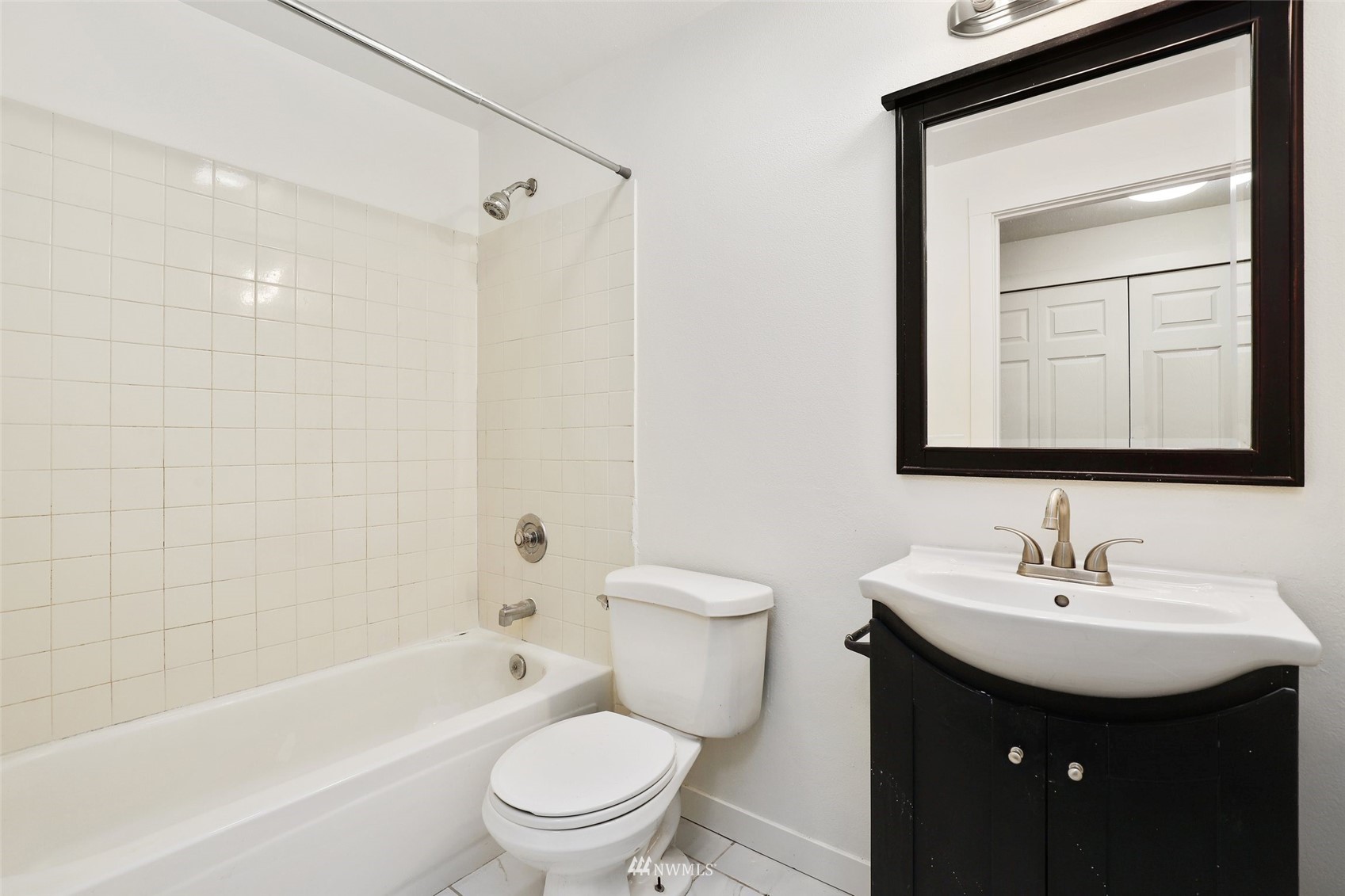 949 Aberdeen Avenue Northeast, Unit B104 Renton, WA 98056 - Photo 15 of 20 a bathroom with a sink toilet vanity and shower
