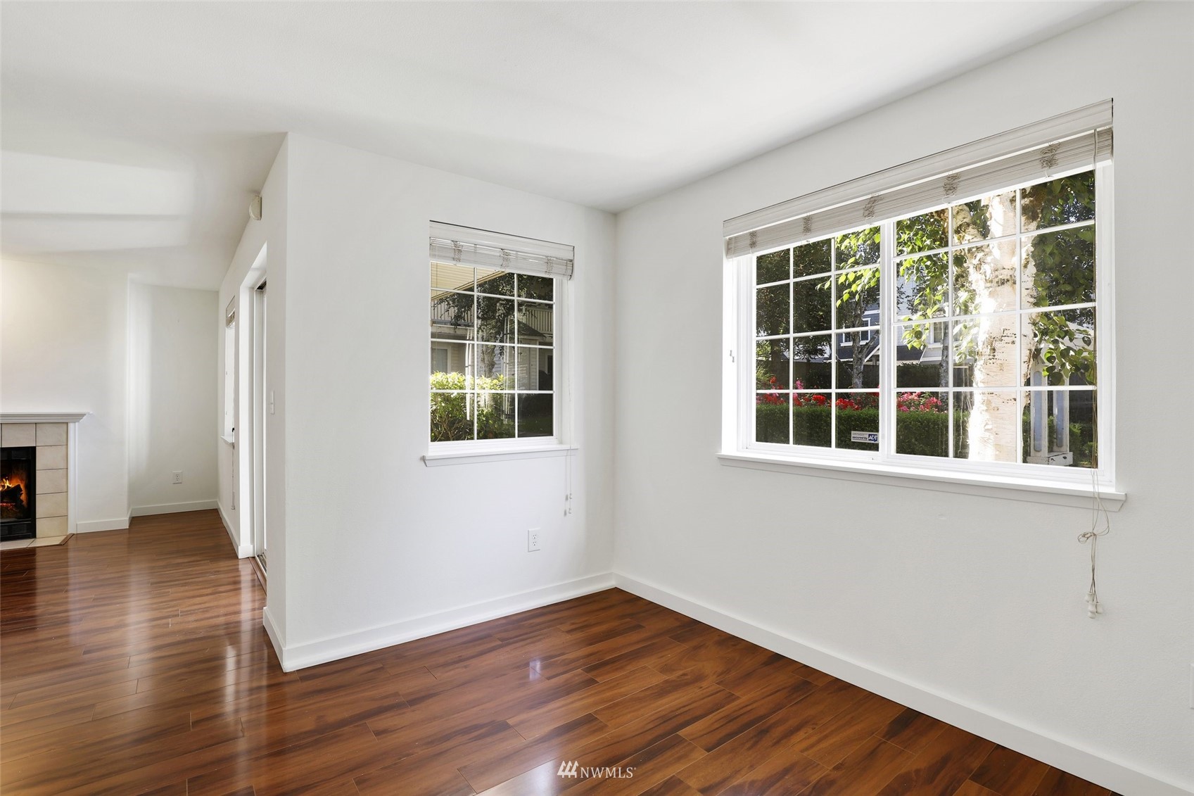 949 Aberdeen Avenue Northeast, Unit B104 Renton, WA 98056 - Photo 6 of 20 a view of an empty room with wooden floor and a window