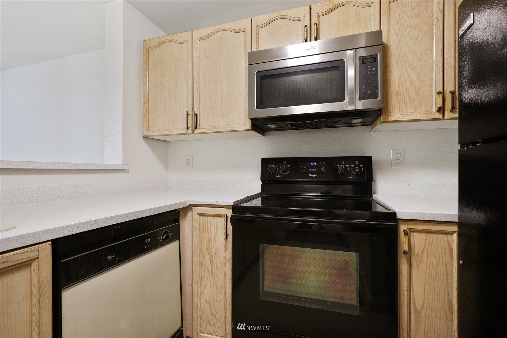 949 Aberdeen Avenue Northeast, Unit B104 Renton, WA 98056 - Photo 9 of 20 a kitchen with stainless steel appliances a stove microwave and sink