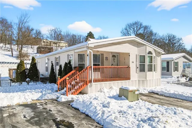 a front view of a house with a patio