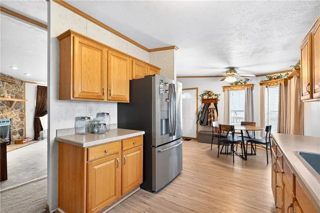 a kitchen with sink cabinets and wooden floor