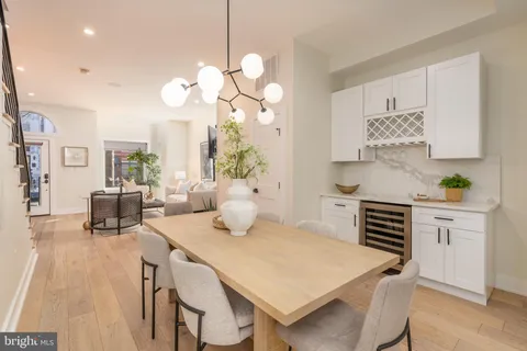 a view of kitchen with cabinets and wooden floor