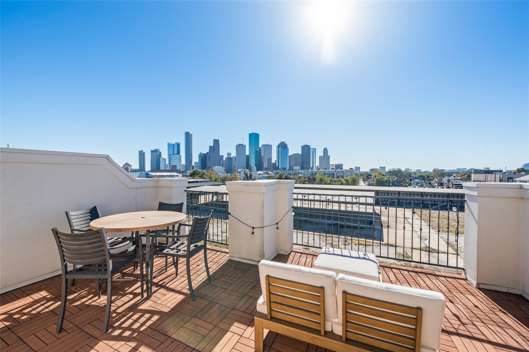 1728 Dart Street Houston, TX 77007 - Photo 32 of 37 a view of a terrace with a table and chairs