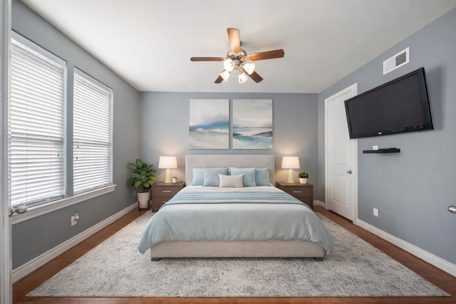 1728 Dart Street Houston, TX 77007 - Photo 9 of 37 a bedroom with a large bed and a flat screen tv